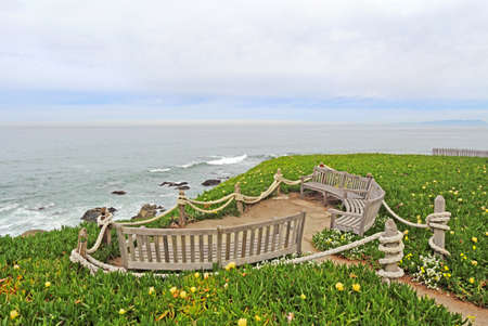 Benches facing the Pacific Ocean at Point Montara Fog Signal and Light Station State Park off of Highway 1 approximately 25 miles south of San Francisco, Californiaの写真素材