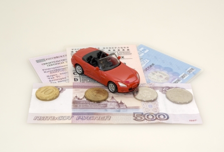 Toy car, money and documentsの写真素材