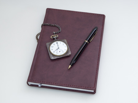 Retro pocket watch, diary and pen 