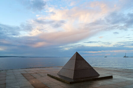 Pyramid on city lake quay in summerのeditorial素材