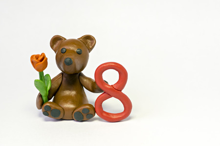 Plasticine bear with flower and eight figureの写真素材