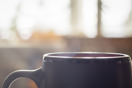 Morning hot cup of coffee with smokeの写真素材