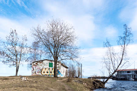 Abandoned house on blue sky backgropund in springの写真素材