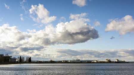 Skyline of cloudy sky in city portの写真素材