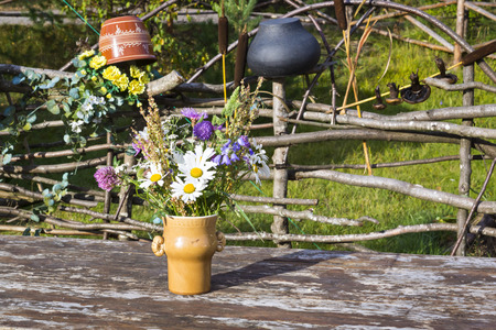 Bouquet of flowers in vase on rustic tableの写真素材