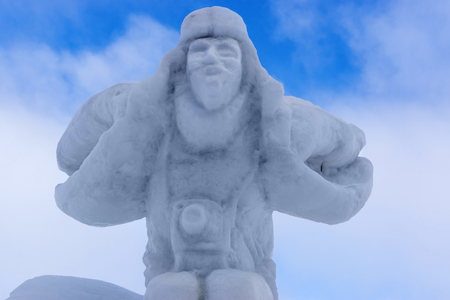 Snow sculpture of dashing photographerの写真素材