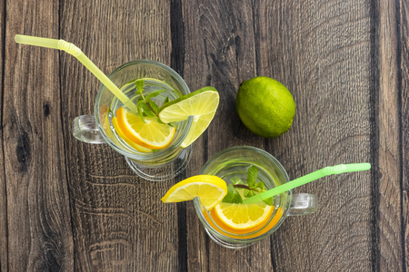 Lemonade with lemon, orange and lemon mint flat layの写真素材