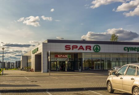Family supermarket building SPAR in city in summer