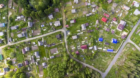 Aerial panorama of houses of Russian old summer cottage village in summerの写真素材