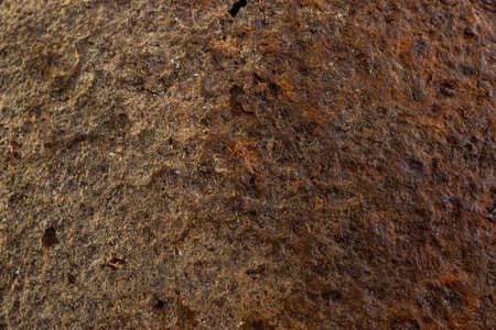 Old brown texture of rough rusty metal background, close-up