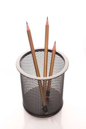 Sharpened pencils in a desktop metal holder in the form of basketの写真素材