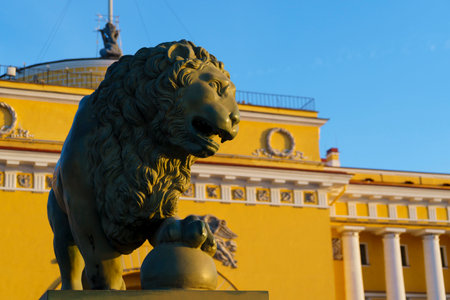 Sculpture of guard lion in St. Petersburg near Admiralty in rays of sunset lightのeditorial素材