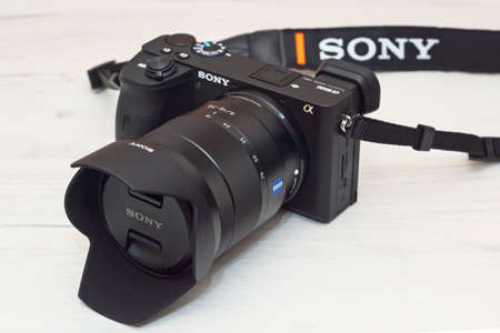 Modern professional small size mirrorless camera with sharp zoom lens