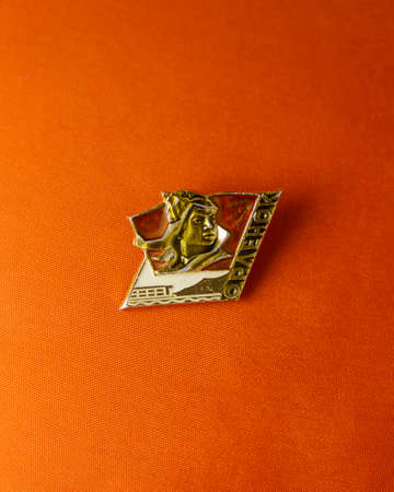 Badge of pioneer camp Eaglet in USSR on background of red pioneer tieのeditorial素材