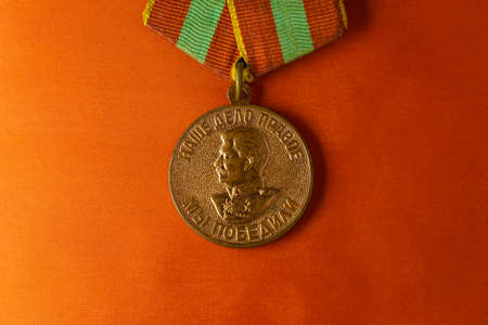 Close up medal for home front labor at Patriotic War with profile of Stalinのeditorial素材
