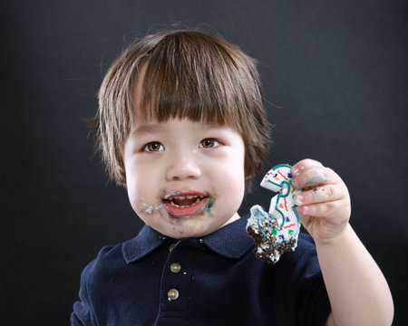 child eating cakeの写真素材