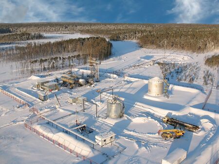 Industrial construction and mechanism. Work of oil industry. Mounting of pipework in wild Siberian taiga.の写真素材