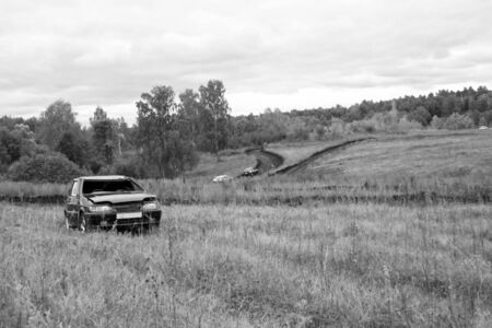 Broken car on a race. Waiting of repair Black and white photoの写真素材