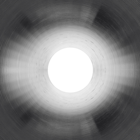 Inside the gas pipeline. Light in the end of a tunnel. Square composition. Black and white photoの写真素材