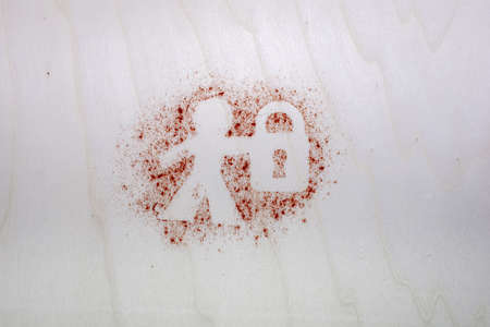 Human silhouette with lock photo from above flat lay - safety symbolic image red pepper particles on wooden texture dynamic top viewの写真素材