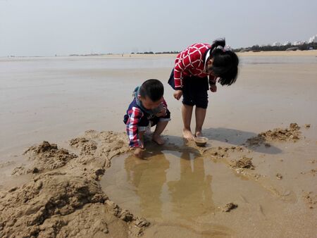 children playing at the beachのeditorial素材