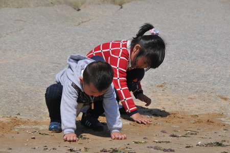children playing at beachのeditorial素材