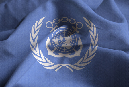 Closeup of Ruffled International Maritime Organization Flag, International Maritime Organization Flag Blowing in Windの写真素材
