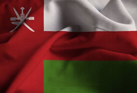 Closeup of Ruffled Oman Flag, Oman Flag Blowing in Windの写真素材