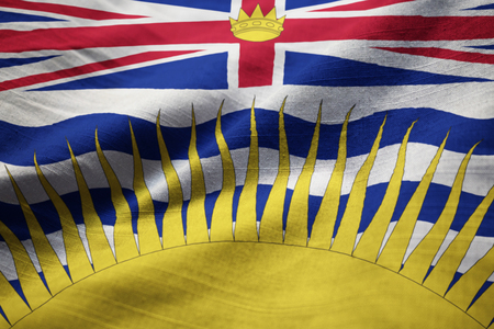 Closeup of Ruffled British Columbia Flag, British Columbia Flag Blowing in Windの写真素材