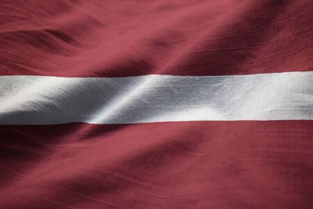 Closeup of Ruffled Latvia Flag, Latvia Flag Blowing in Windの写真素材
