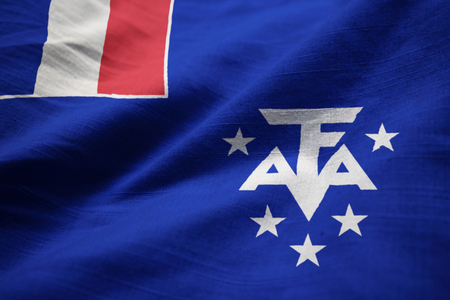Closeup of Ruffled French Southern and Antarctic Lands Flag, French Southern and Antarctic Lands Flag Blowing in Windの写真素材