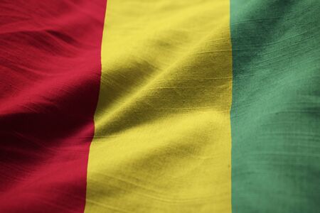 Closeup of Ruffled Guinea Flag, Guinea Flag Blowing in Windの写真素材