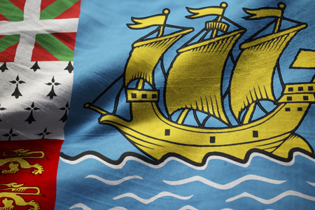 Closeup of Ruffled Saint Pierre and Miquelon Flag, Saint Pierre and Miquelon Flag Blowing in Windの写真素材