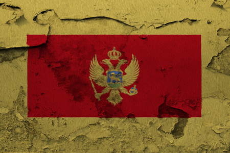 Painted national flag of Montenegro on a concrete wallの写真素材