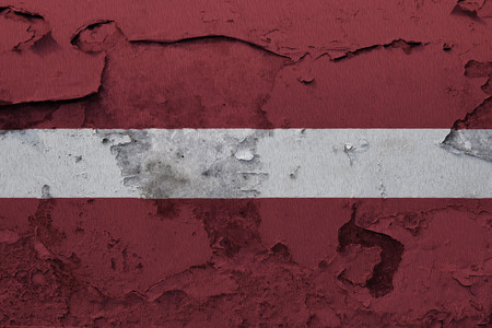 Painted national flag of Latvia on a concrete wallの写真素材