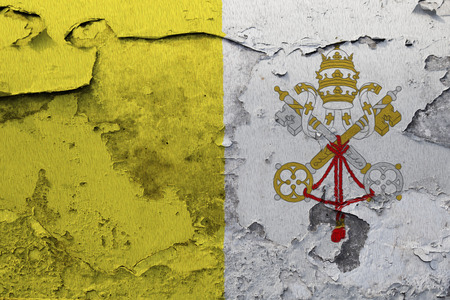 Painted national flag of Vatican City on a concrete wallの写真素材