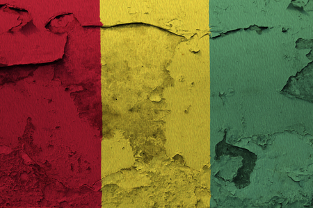 Painted national flag of Guinea on a concrete wallの写真素材
