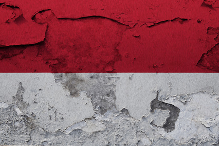 Painted national flag of Monaco on a concrete wallの写真素材