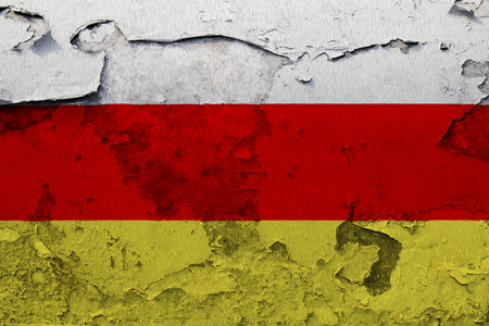 Painted national flag of South Ossetia on a concrete wallの写真素材