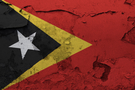 Painted national flag of East Timor on a concrete wallの写真素材