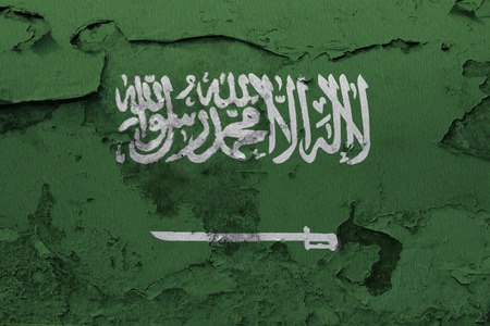 Painted national flag of Saudi Arabia on a concrete wallの写真素材