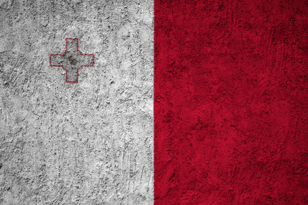 Malta flag on the grunge concrete wallの写真素材