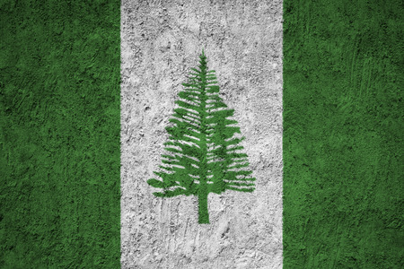 Norfolk Island flag on the grunge concrete wallの写真素材