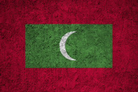 Maldives flag on the grunge concrete wallの写真素材