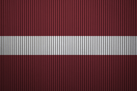 Painted national flag of Latvia on a concrete wallの写真素材