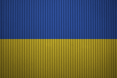 Painted national flag of Ukraine on a concrete wallの写真素材
