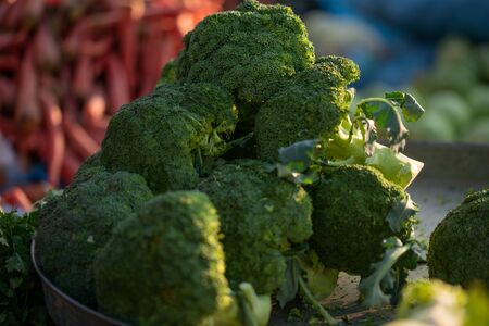 Fresh green organic broccoli displayed in marketの写真素材