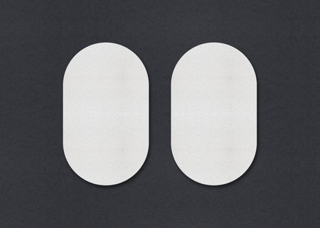 Blank white Business card mockup stacks at grey textured paper background.の写真素材