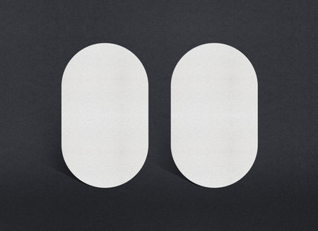 Blank white Business card mockup stacks at grey textured paper background.の写真素材