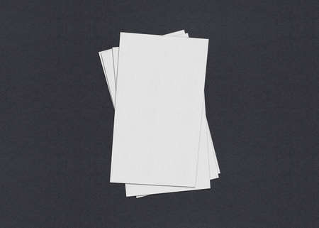 Blank white Business card mockup stacks at grey textured paper background.